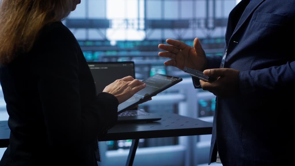 Professionals reviewing claim data and resolving denial management issues